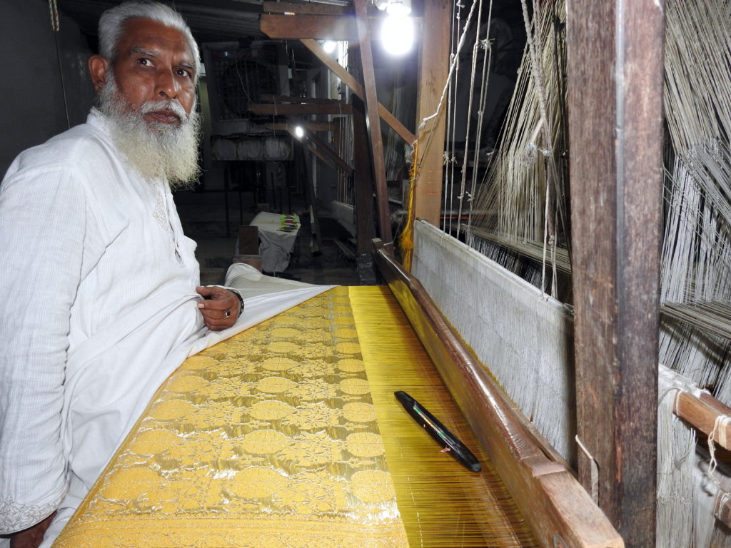 A handloom weaver at work in one of the factories