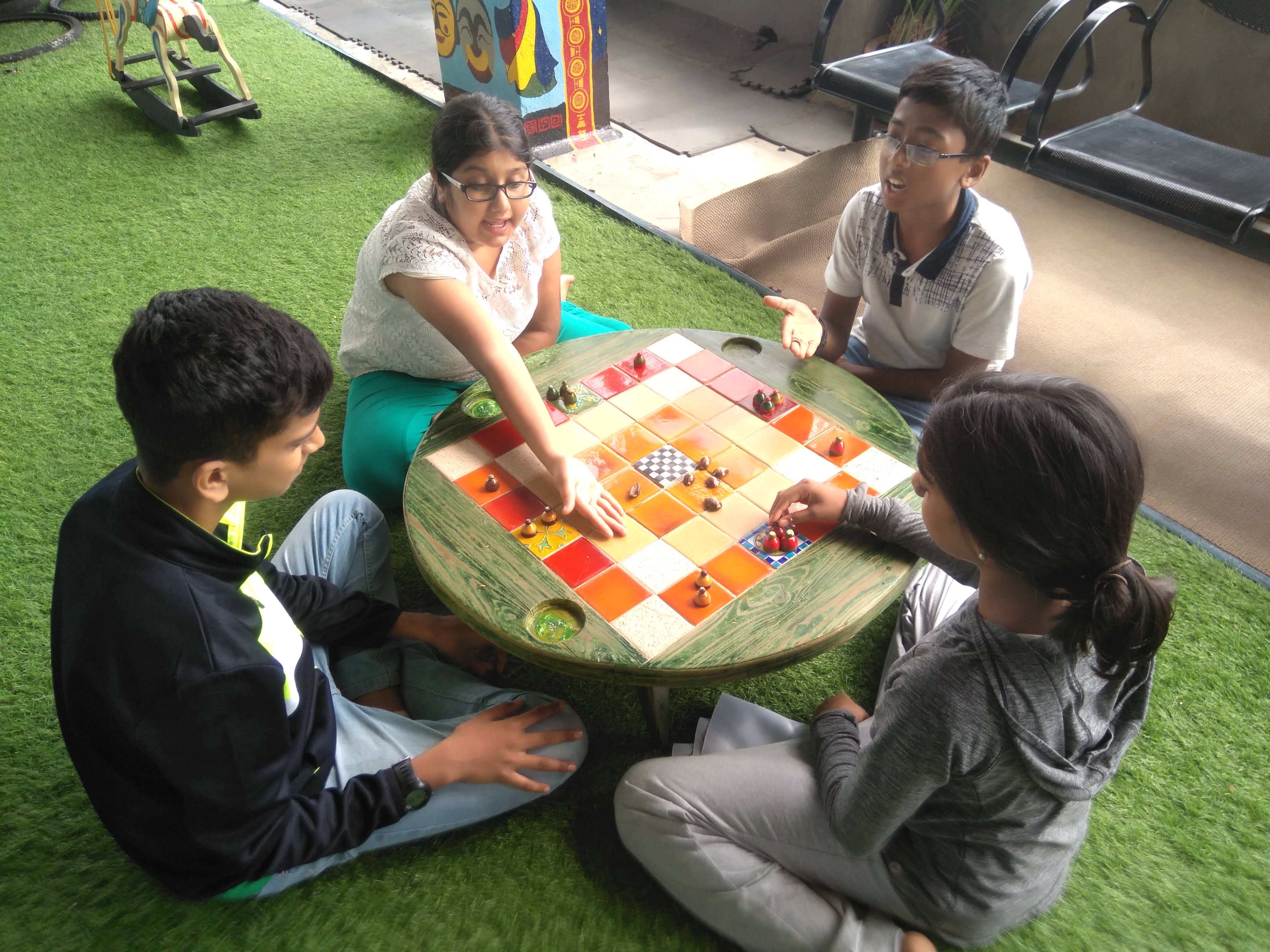 Children playing traditional board games