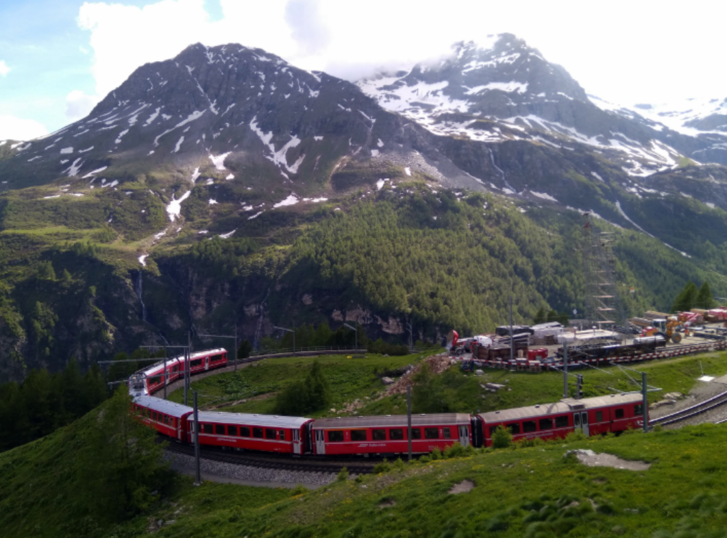 Rhaetian Railway in the Albula Bernina Landscapes at Alp Grum in Switzerland.