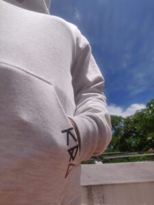 Brand detailing on the pockets of the Ecru Oversized Sweatshirt Hoodie