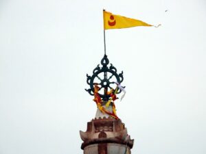 The wheel and flag atop the Jagganath Temple