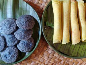Pancakes with caramelized coconut filling and blue pea flower infused wandu appam