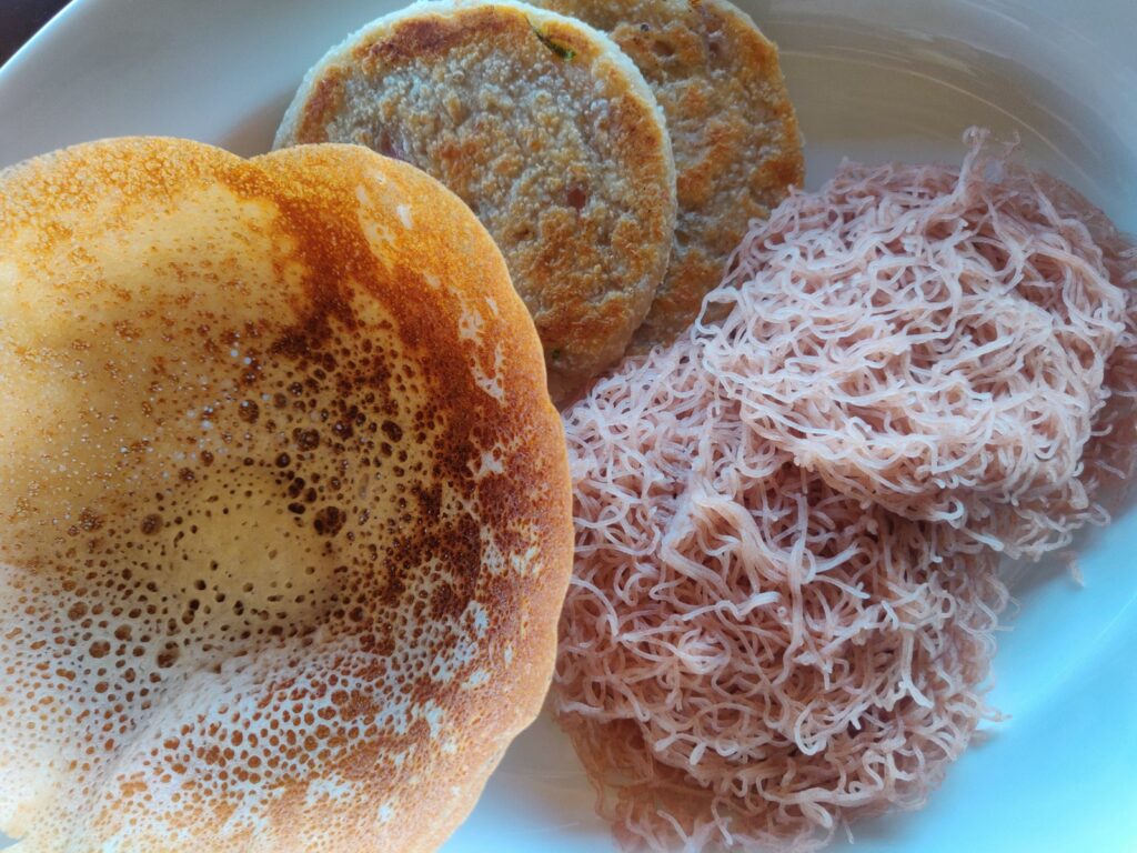 Plain hoppers and string hoppers with coconut roti